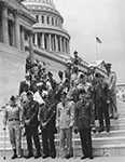 Photo of Dole with veterans on the steps of the US Capitol, 1966